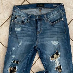 Distressed leopard jeans